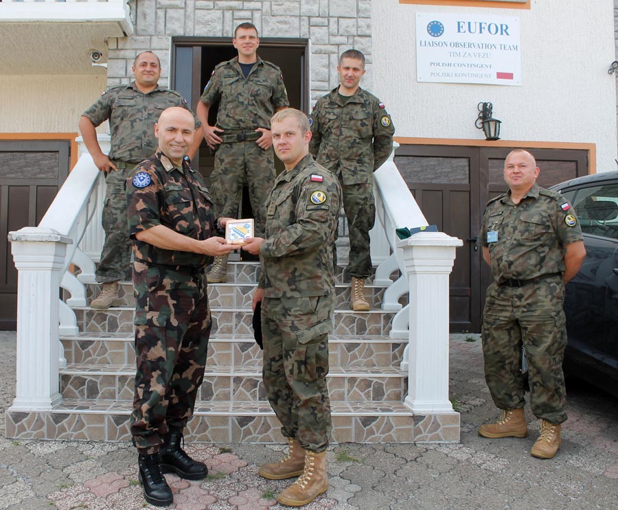 Brigadier General Szpisják together with the team in front of the EUFOR House