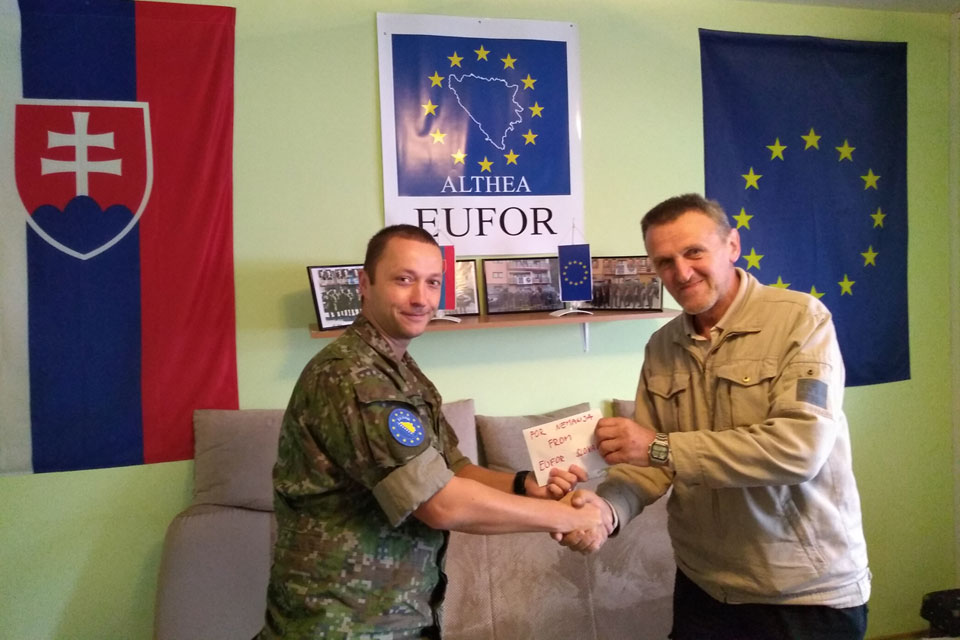 LOT FOCA commander Captain Tibor Petricek handing over money to Mr Luka Bodiroga