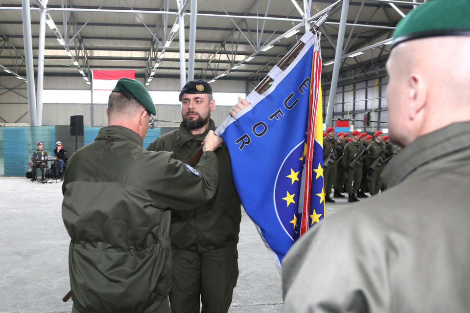 Lieutenant Colonel Sanz receives the MNBN colours from Commander EUFOR